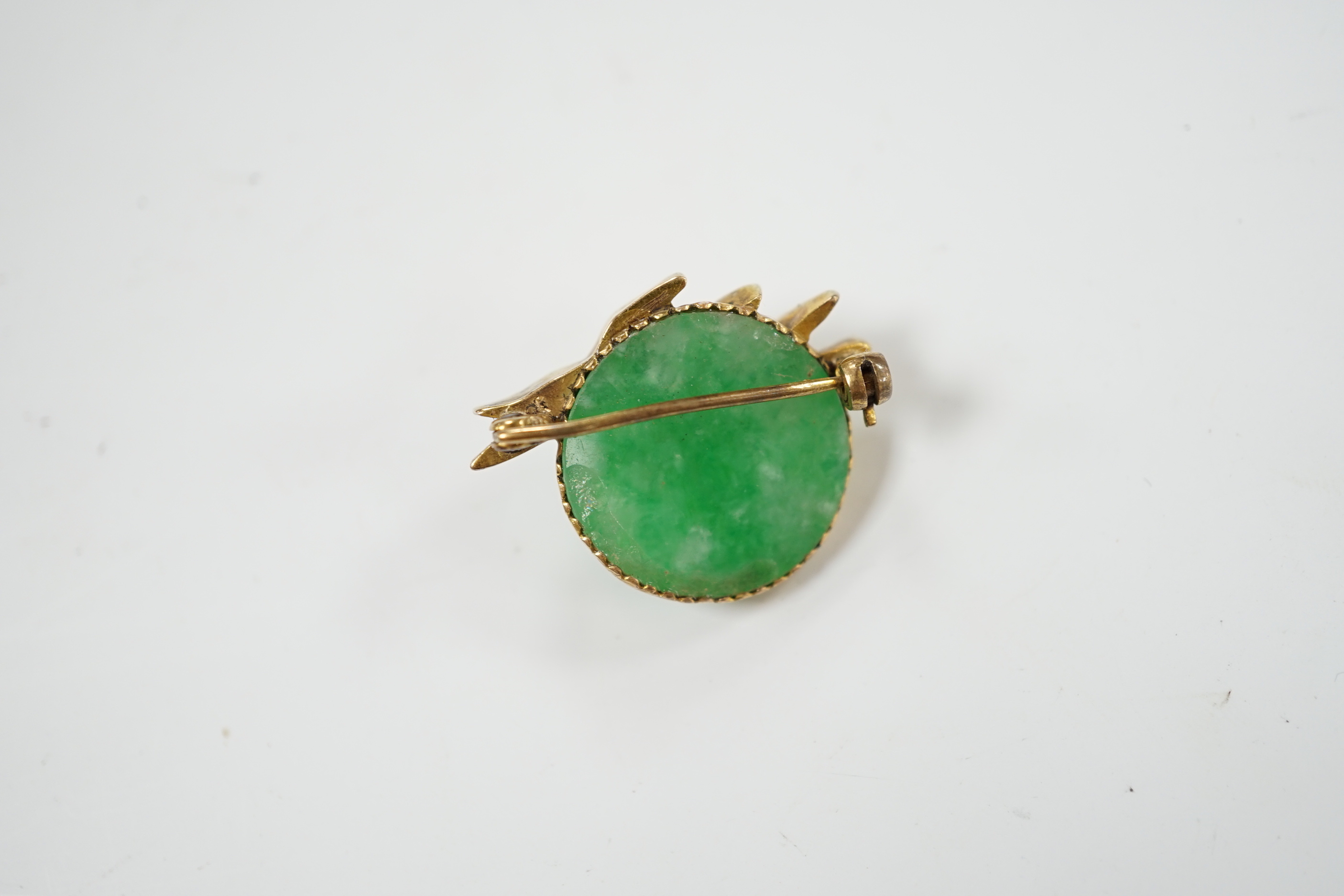 A Chinese? yellow metal mounted jade brooch, the mount with three birds, 29mm, gross weight 7.6 grams.